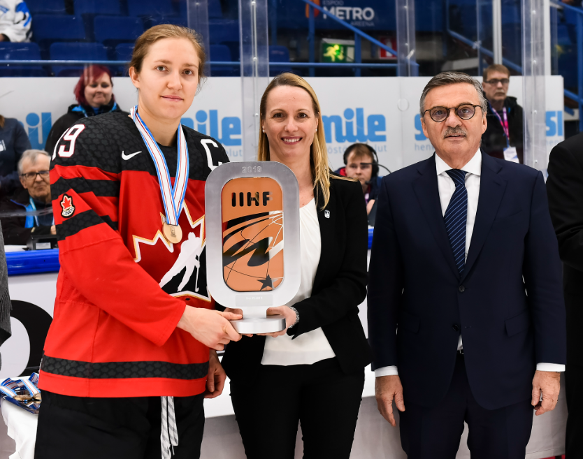 Brianne Jenner accepts the bronze medal trophy at the 2019 Worlds