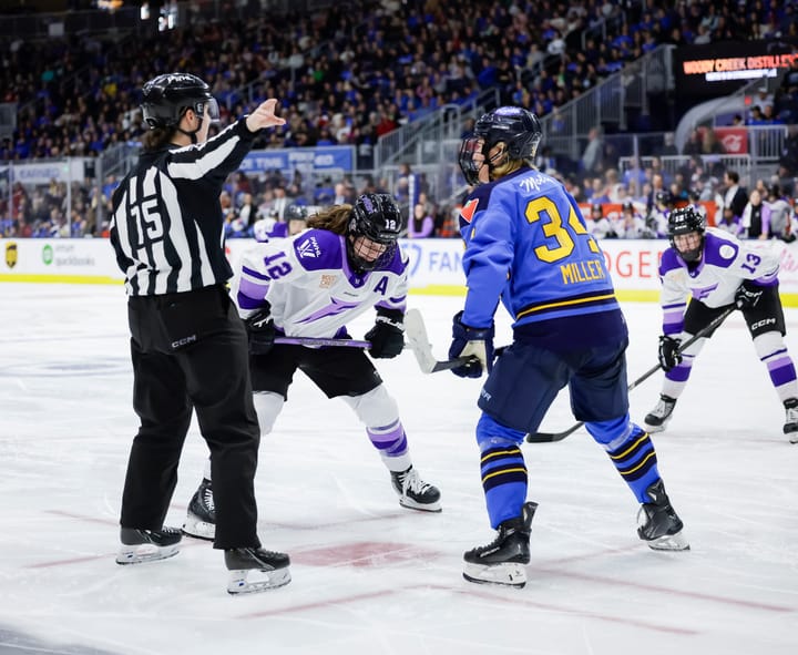 Pannek (left in white) is crouched down looking at the dot, while Miller (right in blue) is looking at the ref but getting ready to join her.