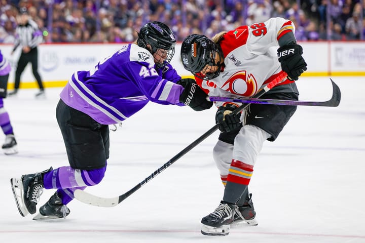 Claire Thompson defends against Danielle Serdachny